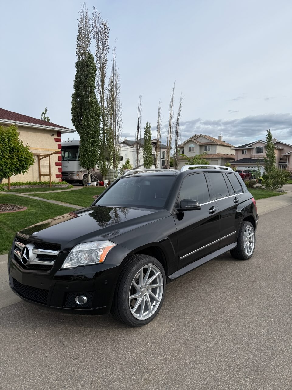 Black Mercedes-Benz GLK on silver directional wheels