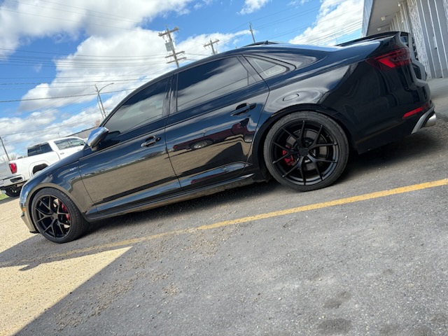 Black Audi S4 on matte black wheels with red calipers