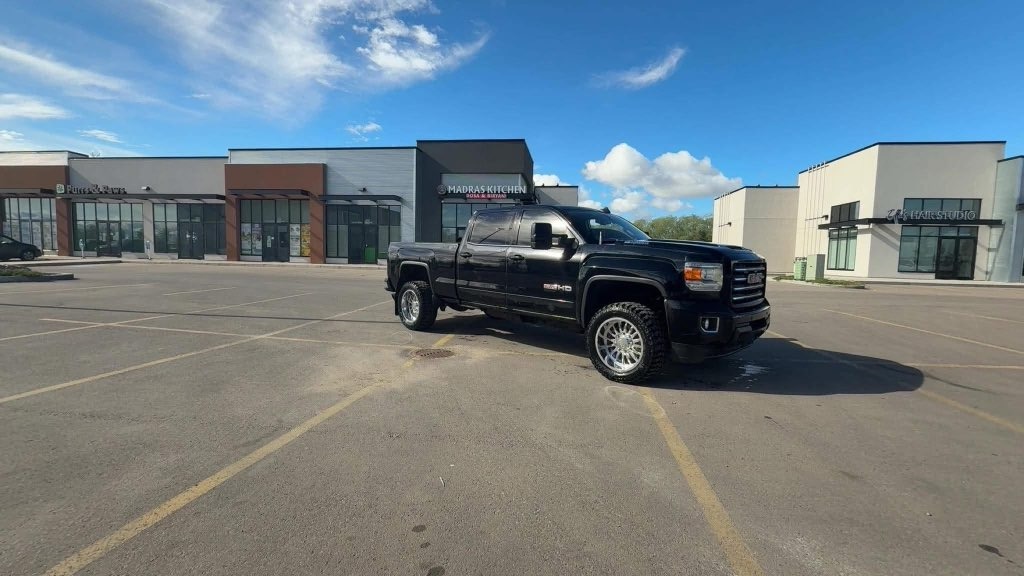 Black GMC Sierra HD on machined wheels