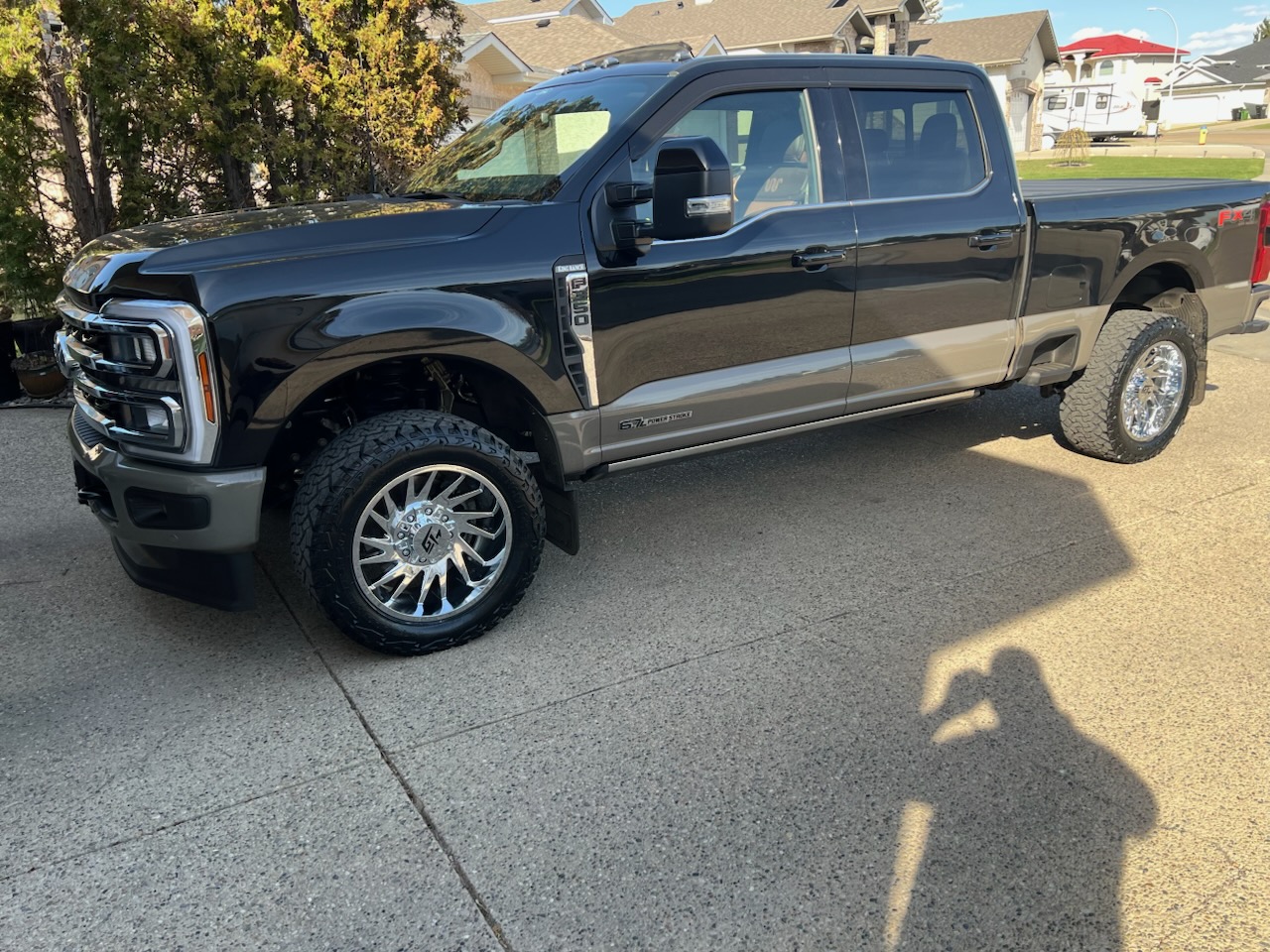 Black Ford F-350 Power Stroke on chrome forged wheels