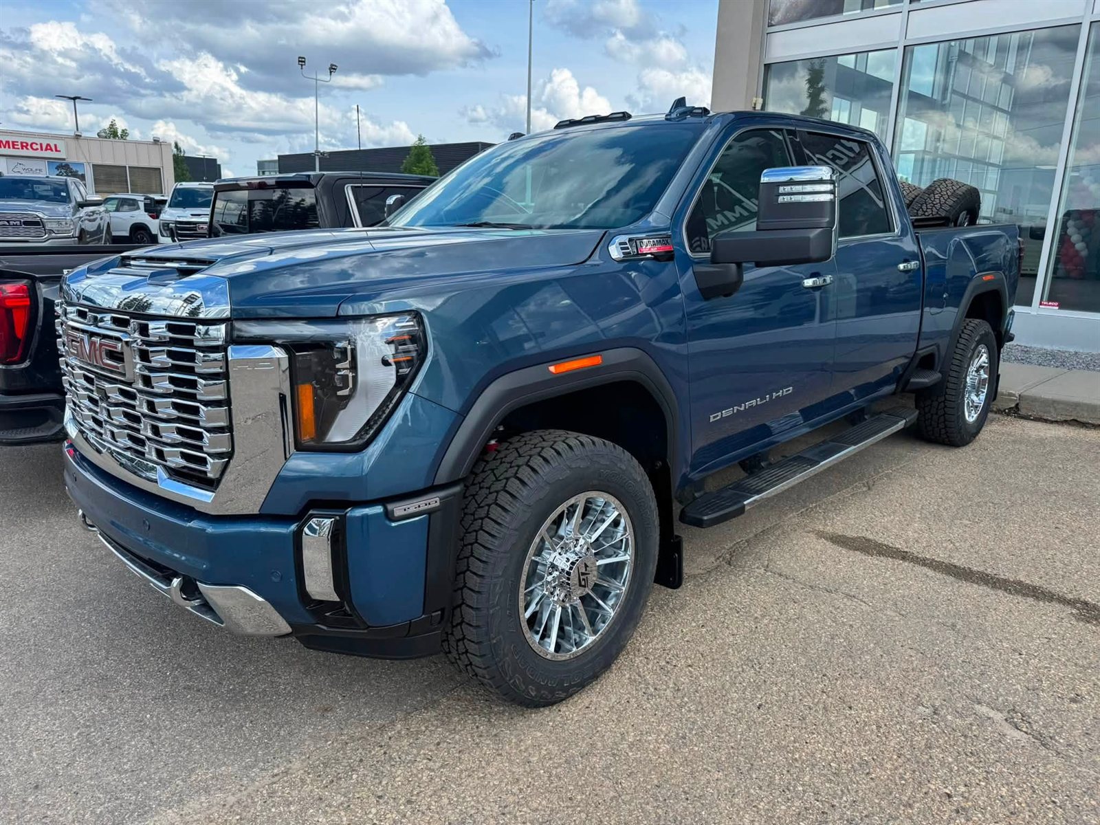 Blue GMC Sierra 2500 Denali HD Duramax on chrome wheels